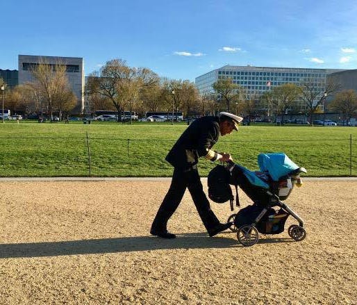 Former Surgeon General Vivek Murthy is shown walking his young son on the Washington, D.C. mall while he was in office.