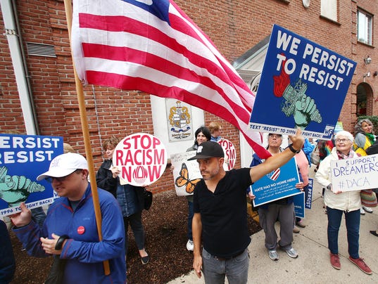 Adam Bell, c, of Verona joined Immigrant rights organizations protesting in front of the Congressional district office of Rodney Frelinghuysen demanding to speak with him as well as legislation that provides a path to citizenship showing in force they will not let DACA go without a fight