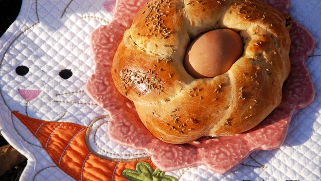 Scarcella di Pasqua is a sweet Italian Easter bread studded with dried fruit and seeds, and baked with whole eggs nestled in the dough.