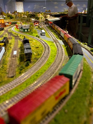 Head engineer Paul Schnoes controls several model trains at the Shell Point Retirement Community’s Gulf Coast Model Railroad attraction.The model train display is scheduled to open for the season on Oct. 5