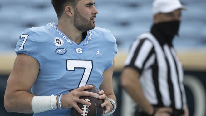 Quarterback Sam Howell warms up prior to North Carolina's season-opening victory against Syracuse.