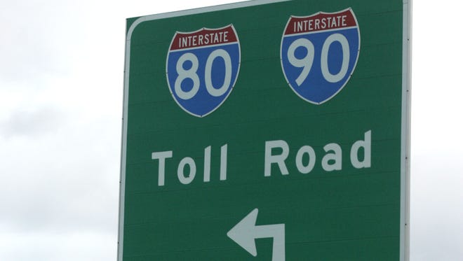 A truck passes by the sign for the LaPorte Toll Plaza of the Indiana Toll Road. Similar toll roads are being considered for the Indianapolis area.