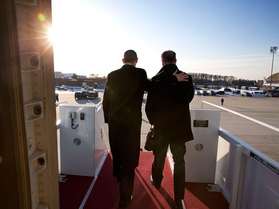 President Barack Obama and Dan Pfeiffer disembark Air