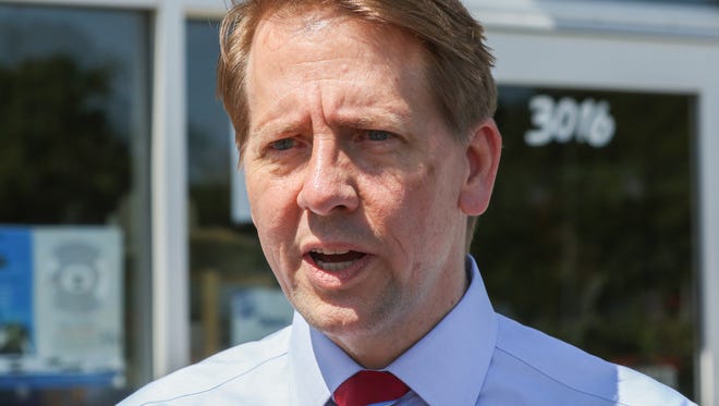 Richard Cordray, democratic Ohio gubernatorial candidate, speaks with media outside Beyond Image Barber Salon in Camp Washington, Cincinnati, on Friday, June 29, 2018, after a fundraising event.