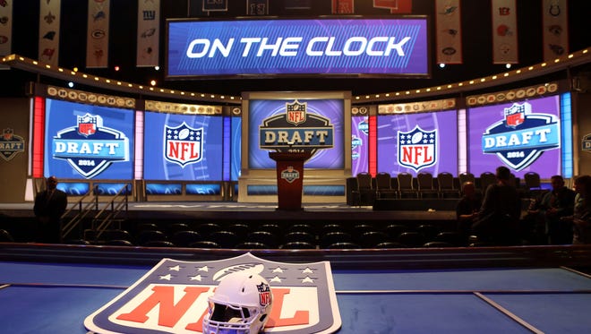 A general view of a helmet, NFL shield, stage, and podium before the start of the 2014 NFL Draft at Radio City Music Hall.