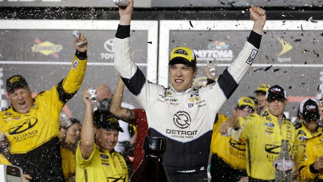 Brad Keselowski (Rochester Hills) celebrates in Victory Lane after winning the NASCAR Sprint Cup Series auto race Saturday at Daytona International Speedway.