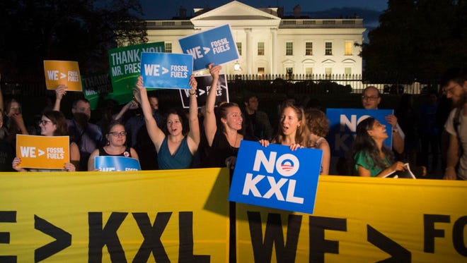 Environmentalists celebrate outside the White House on Nov. 6, 2015.