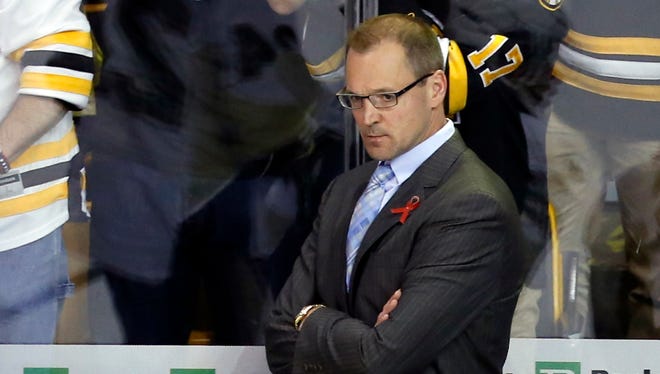 Pittsburgh Penguins head coach Dan Bylsma reacts to being swept by the Boston Bruins in game four of the Eastern Conference finals of the 2013 Stanley Cup Playoffs at TD Garden.