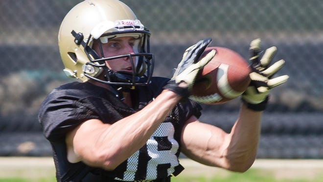 Purdue wide receiver Cameron Posey  catches the ball during a drill Thursday, August 14, 2014, during practice on campus in West Lafayette.