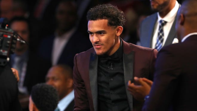 Trae Young reacts after being drafted fifth overall by the Dallas Mavericks during the 2018 NBA draft.