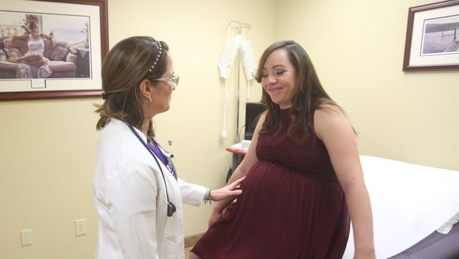 Dr. Lilia Pacini attends to her pregnant patient, Maria Barba, 27, on Nov. 16, 2016. Barba has had two other children by vaginal delivery.