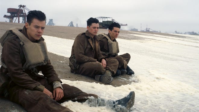 This image released by Warner Bros. Pictures shows Harry Styles, from left, Aneurin Barnard and Fionn Whitehead in a scene from “Dunkirk.”