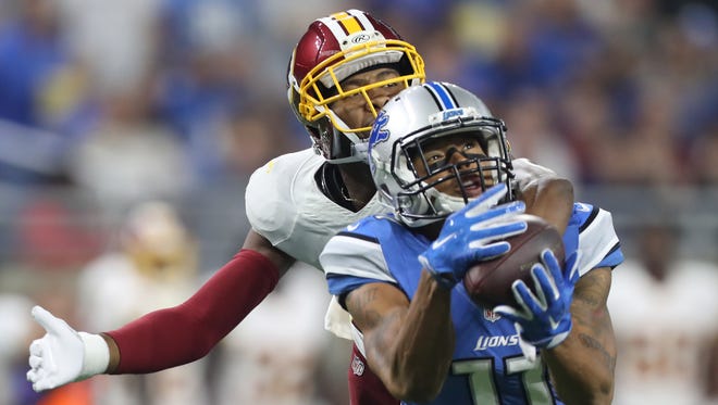 Lions receiver Marvin Jones Jr. makes a 52-yard catch against the Washington Redskins' Josh Norman during the second half Sunday, Oct. 23, 2016 at Ford Field in Detroit.
