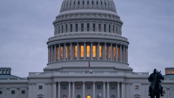 The Capitol is seen under early morning gray skies in Washington, Dec. 20, 2018.