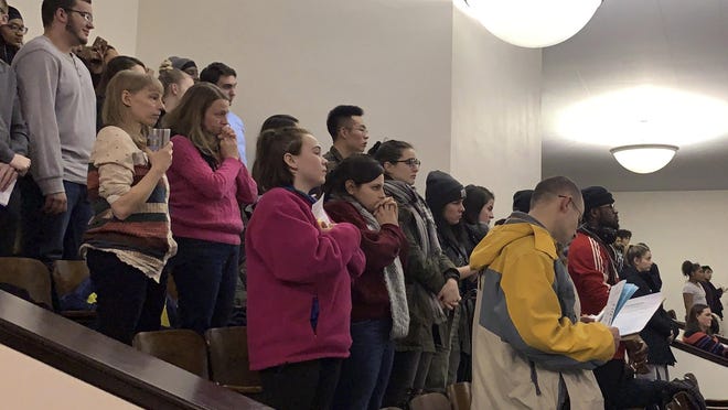 In this Tuesday, Jan. 22, 2019 photo, members of the public fill the seats at a meeting of the Binghamton school board in Binghamton, N.Y. Community members packed the meeting to demand answers after reports circulated on social media that four girls were strip-searched by the school nurse and assistant principal at a Binghamton middle school because they seemed giddy in the lunch room.