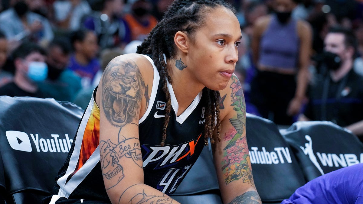 FILE - Phoenix Mercury center Brittney Griner sits during the first half of Game 2 of basketball's WNBA Finals against the Chicago Sky, Wednesday, Oct. 13, 2021, in Phoenix. Brittney Griner said she's "grateful" to be back in the United States and plans on playing basketball again next season for the WNBA's Phoenix Mercury a week after she was released from a Russian prison and freed in a dramatic   high-level prisoner exchange. "It feels so good to be home!" Griner posted to Instagram on Friday, Dec. 16, 2022, in her first public statement since her release. (AP Photo/Rick Scuteri, File)
