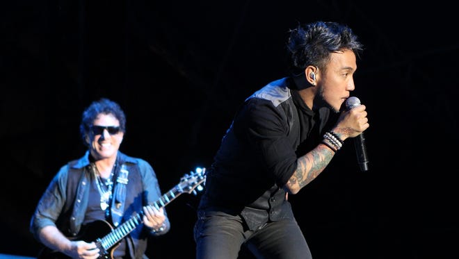 Arnel Pineda, right, and Neal Schon will perform with Journey on May 27 at Indianapolis Motor Speedway.