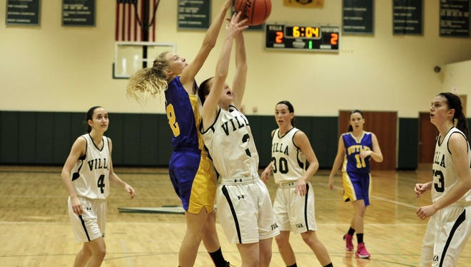 Butler's Melissa Konopinski, left in blue, scored 12 points in the opening round of the Butler Holiday Tournament this week to help lead the Bulldogs to the championship game against  West Milford.