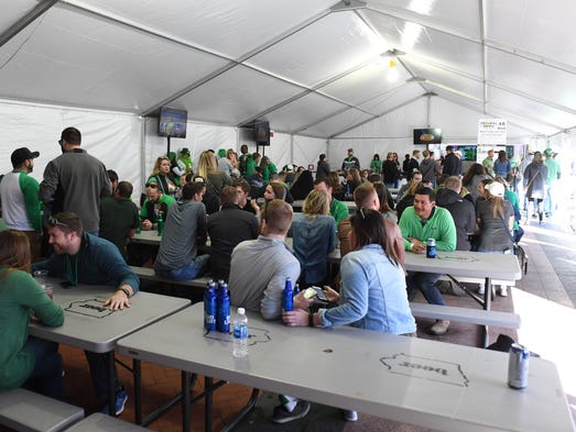 Drinkers watch the game and drink craft beer on Friday,