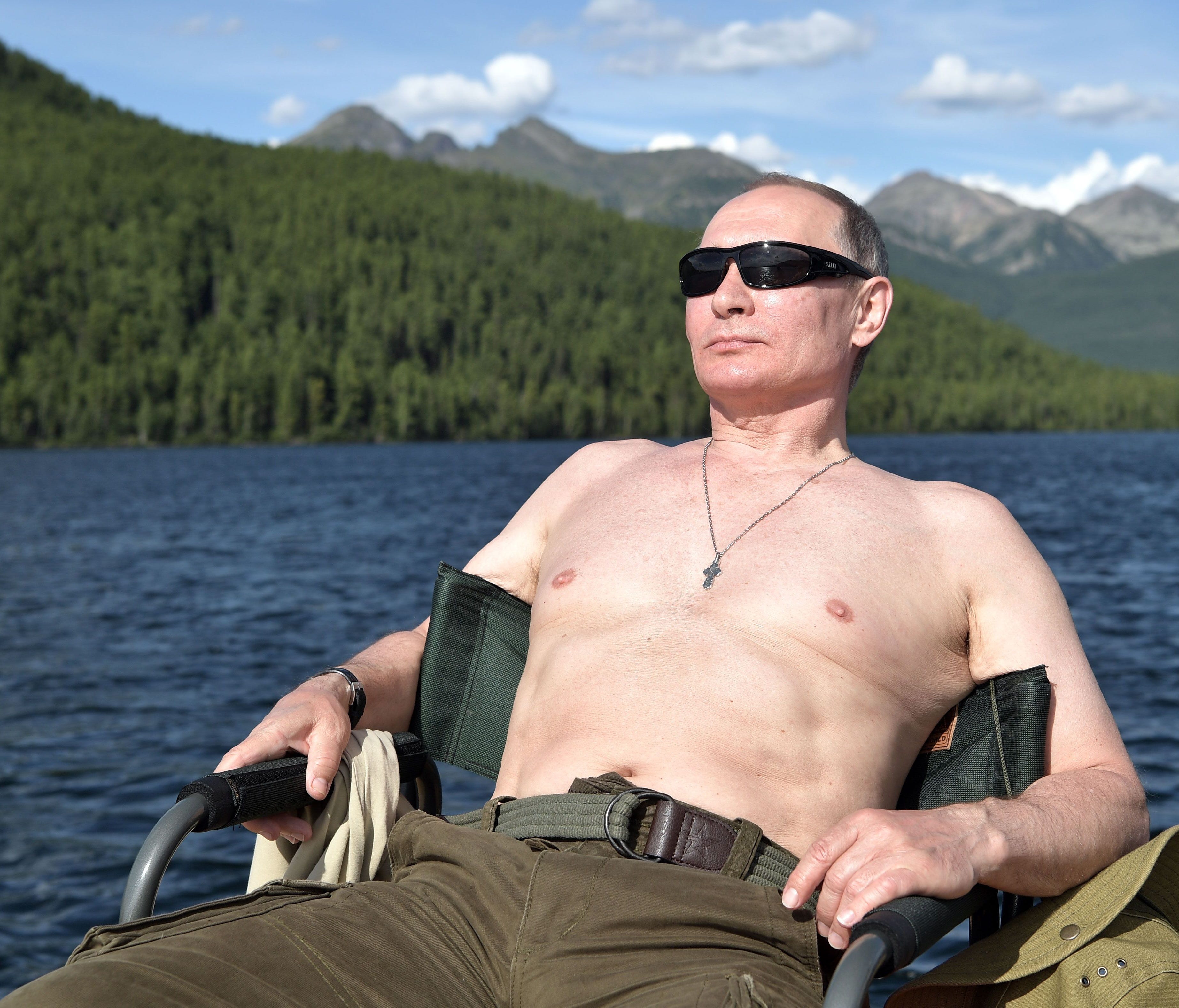 Russian President Vladimir Putin sunbathes during his vacation in the remote Tuva region in southern Siberia.