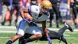 James Madison wide receiver John Miller tries to avoid