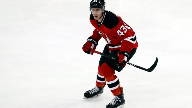 New Jersey Devils left wing Ben Thomson skates against the Pittsburgh Penguins during the third period of an NHL hockey game, Thursday, April 6, 2017, in Newark, N.J. (AP Photo/Julio Cortez)