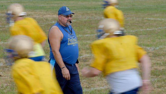 Lincoln High School Football Coach Phil Renforth leads practice Wednesday, Aug. 10, 2016 in Cambridge City.