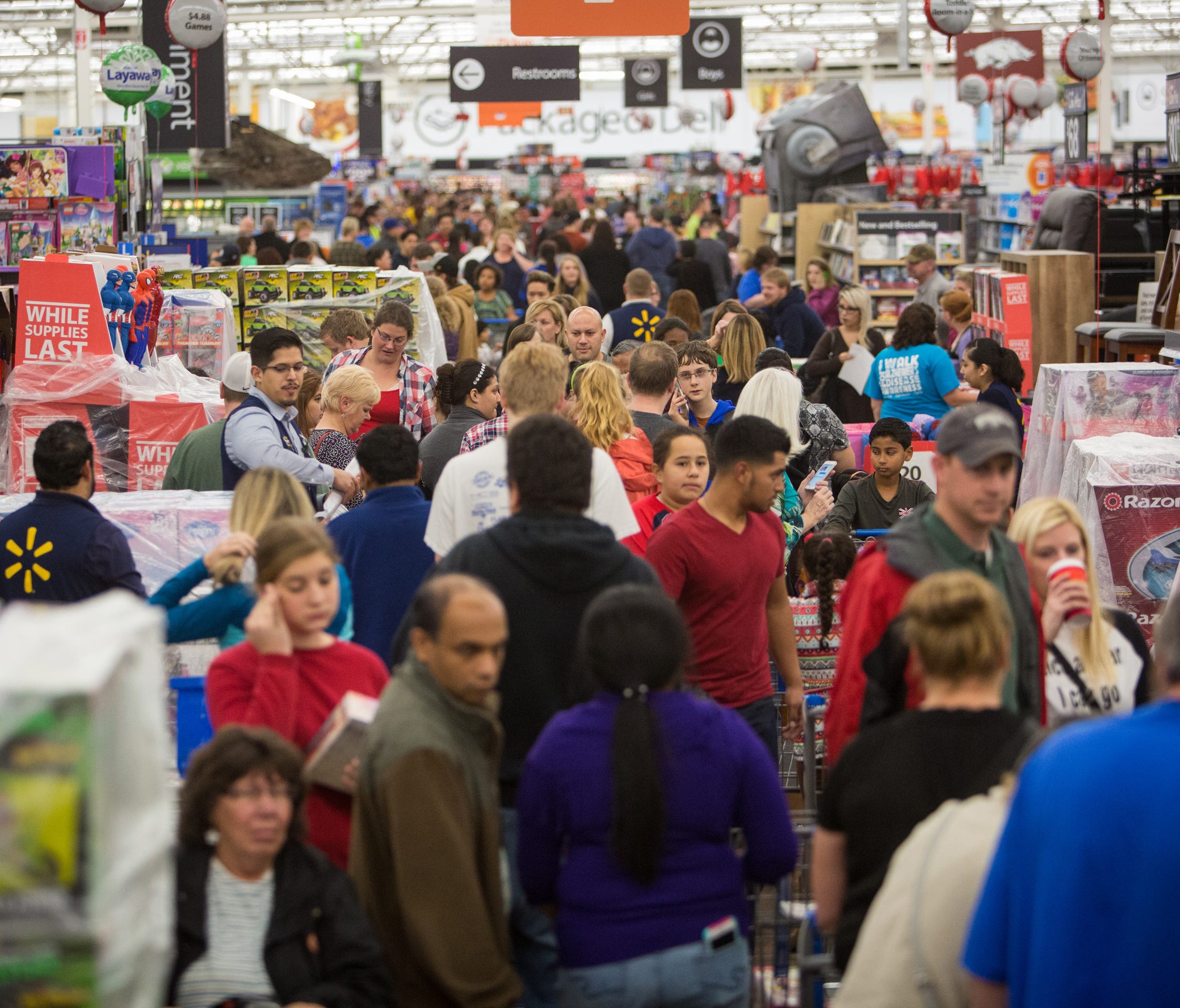 Customers save big at Walmart's Black Friday shopping event in Rogers, Ark. Hundreds of customers at Walmart stores across the country took advantage of deals on top items, like televisions, video game consoles, and toys. Easy shopping continues in W