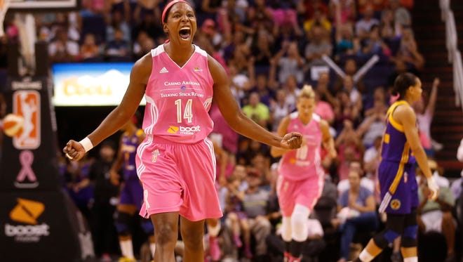 Phoenix Mercury guard Shay Murphy (14) celebrates a basket against the Los Angeles Sparks during the fourth quarter at US Airways Center in Phoenix, Ariz. July 29, 2014. Mercury players wore pink for breast health awareness.