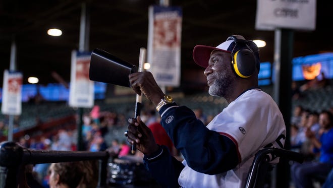 Bruce "Secret Weapon" Pittman rings a cowbell during an Evansville Otters playoff game in 2017. Pittman died Sunday.