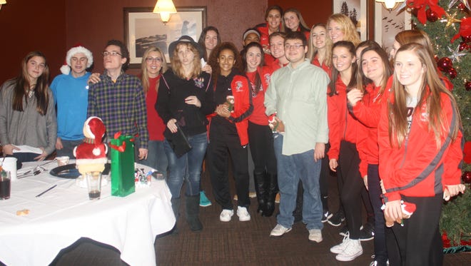 Members of the Livonia Churchill girls basketball team helped throw a party for several Wayne County autistic residents on Dec. 23 in the Twelve Oaks Mall Macy’s.