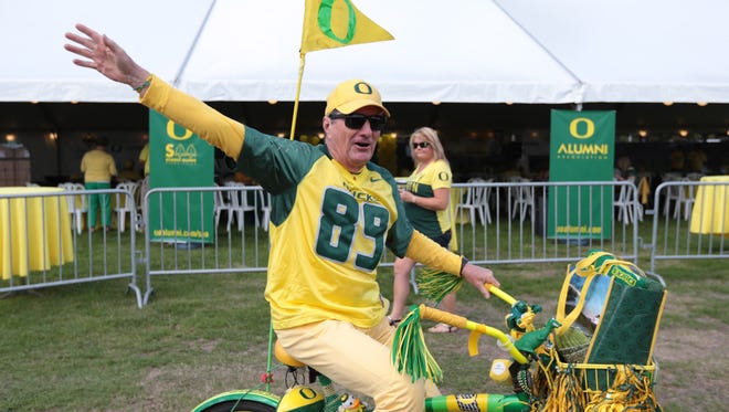 Sep 5, 2015; Eugene, OR, USA; Oregon Ducks fan rides by on a pedal bike thanking Eastern Washington Eagles fans for attending the game at Autzen Stadium. Mandatory Credit: Scott Olmos-USA TODAY Sports