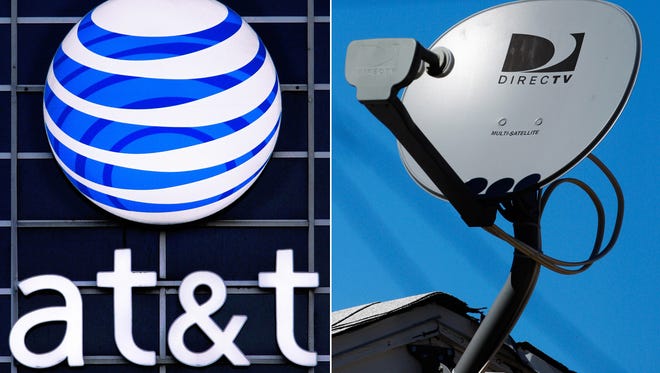 This file combo made from file photos shows the AT&T logo on the side of a corporate office in Springfield, Ill., left, and a DirecTV satellite dish atop a home in Los Angeles. AT&T, the second-largest U.S. wireless carrier, on May 18, 2014 agreed to buy satellite TV company DirecTV for $48.5 billion.