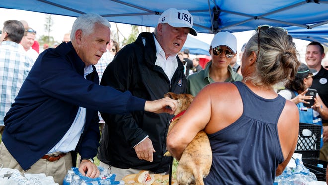 President Trump, first lady Melania Trump and Vice President Pence meet and talk to people impacted by Hurricane Irma in Naples, Fla. Thursday.