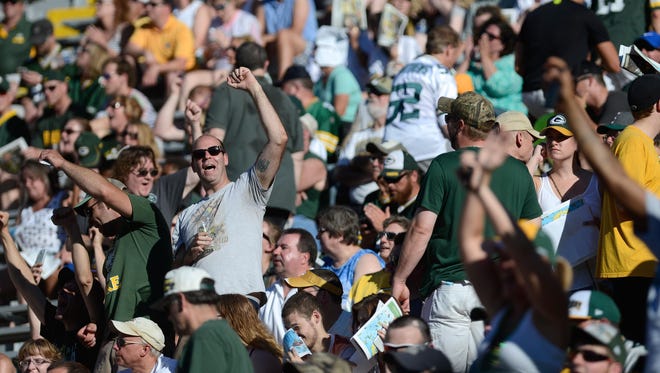Fans cheer as they wait for Brett Favre to come out and speak in the bowl of Lambeau Field to a sold out crowd as he is inducted into the Green Bay Packers Hall of Fame.