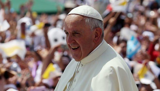 Pope Francis waves to the crowd during his visit to Guayaquil, Ecuador, July 6, 2015.