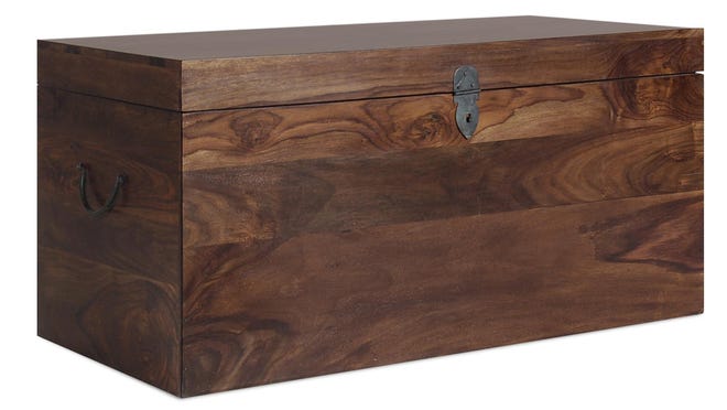 In this photo provided by Boston Interiors, crafted in warm Himalayan sheesham wood, the Plantation storage trunk offers capacious storage, while serving as a handsome coffee table. It’s a good option for mobile Millennials who may want to invest in versatile furniture that can be easily moved from home to home.