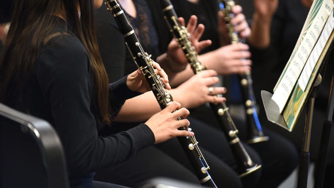 The South Albany High School Symphonic Band warms up before a performance on Thursday, April 16, 2015, at Crescent Valley High School in Corvallis. A fire at South Albany High School earlier this month destroyed the band and choir practice rooms, which housed the band’s instruments and other equipment. The band is currently using loaned instruments.