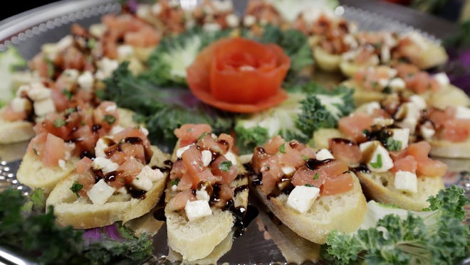 A tray of tomato, mozzarella and balsamic bruschetta  at Marq Banquet and Catering in De Pere.