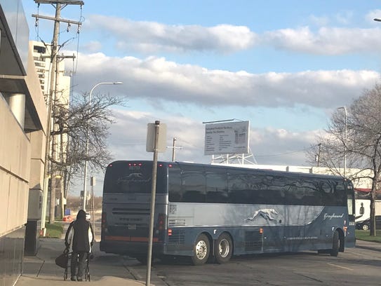A Greyhound bus pulls out of the Detroit bus terminal