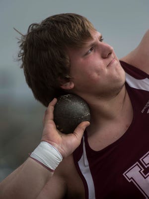 Henderson's Cade Russell throws the shot put during the Colonel Classic track meet at Henderson County High School on Saturday, March 17, 2018. Russell won the region title in the event Friday at McCracken County High School in Paducah.