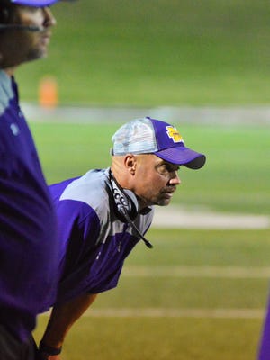 Merkel coach John Cornelius watches a play unfold during the third quarter of Thursday's game with Eastland at Shotwell Stadium.