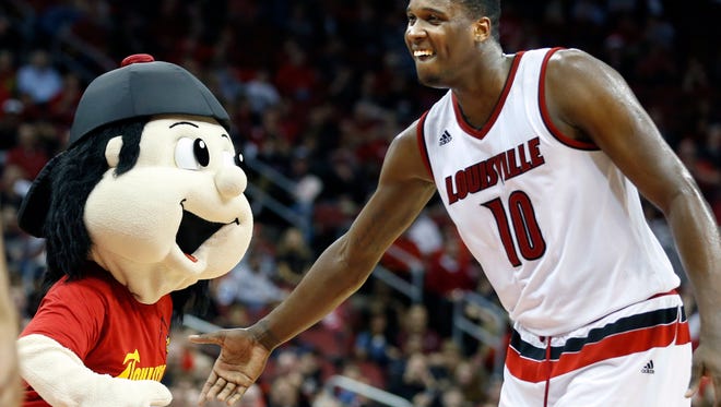 Louisville's Jaylen Johnson and Bompy have a little fun during a timeout. 
Dec. 23, 2015