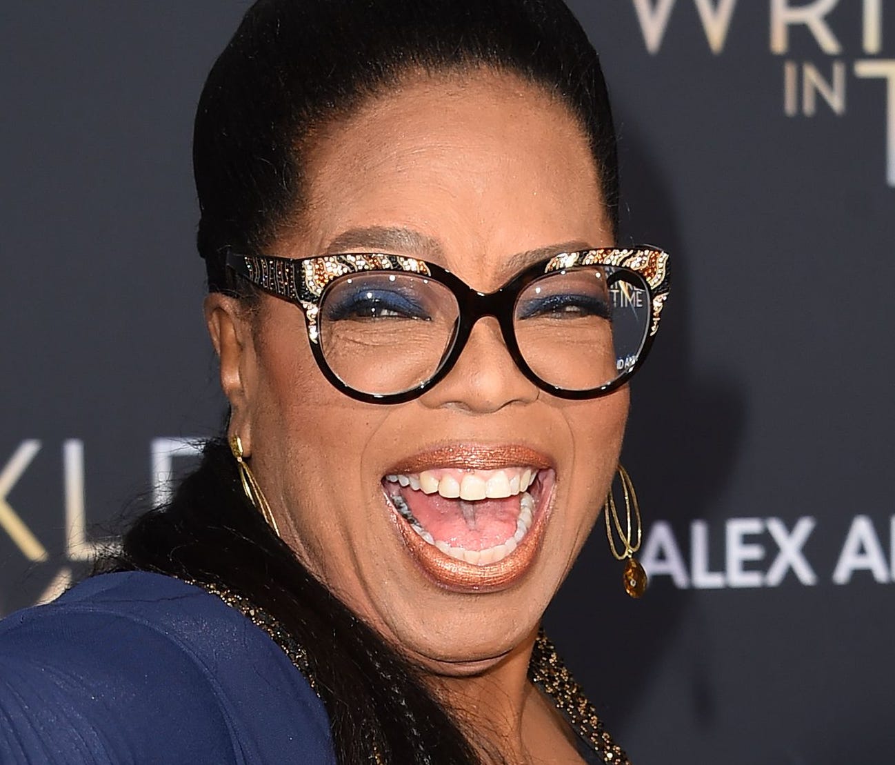 Oprah Winfrey comes in navy to the blue carpet for Disney's 'A Wrinkle in Time' premiere, at the El Capitan Theatre, in Hollywood.