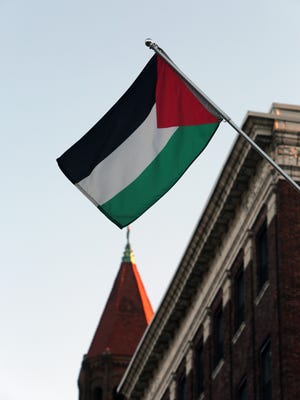 A Palestinian flag flies from a light pole outside of 81 South Broadway in Yonkers on Dec. 4.