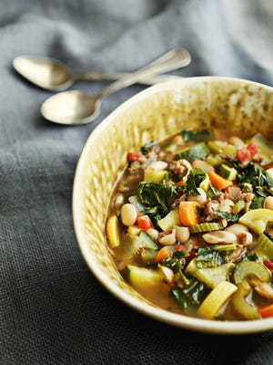 To help us all, here's a rundown of some new cookbooks that might offer inspiration, including a recipe for Tuscan white bean soup with sausage and kale. (Juli Leonard/Raleigh News & Observer/TNS)