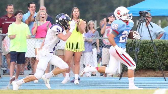 USJ's William Jones runs the ball 90 yards for a kickoff return touchdown Friday against TCA.
