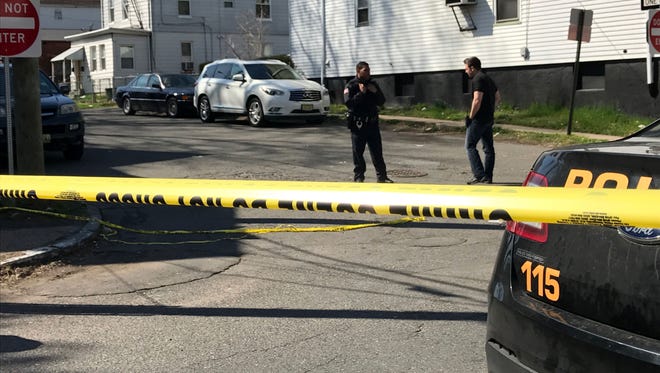 Police at the scene of a shooting in Paterson on Friday, April 14, 2017.