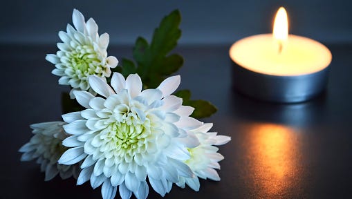 Candle and white flowers