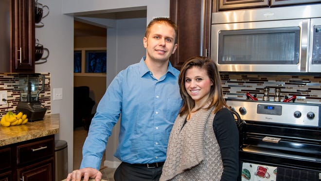 Home buyers Joe and Rachael Short in their new home in Irondequoit.